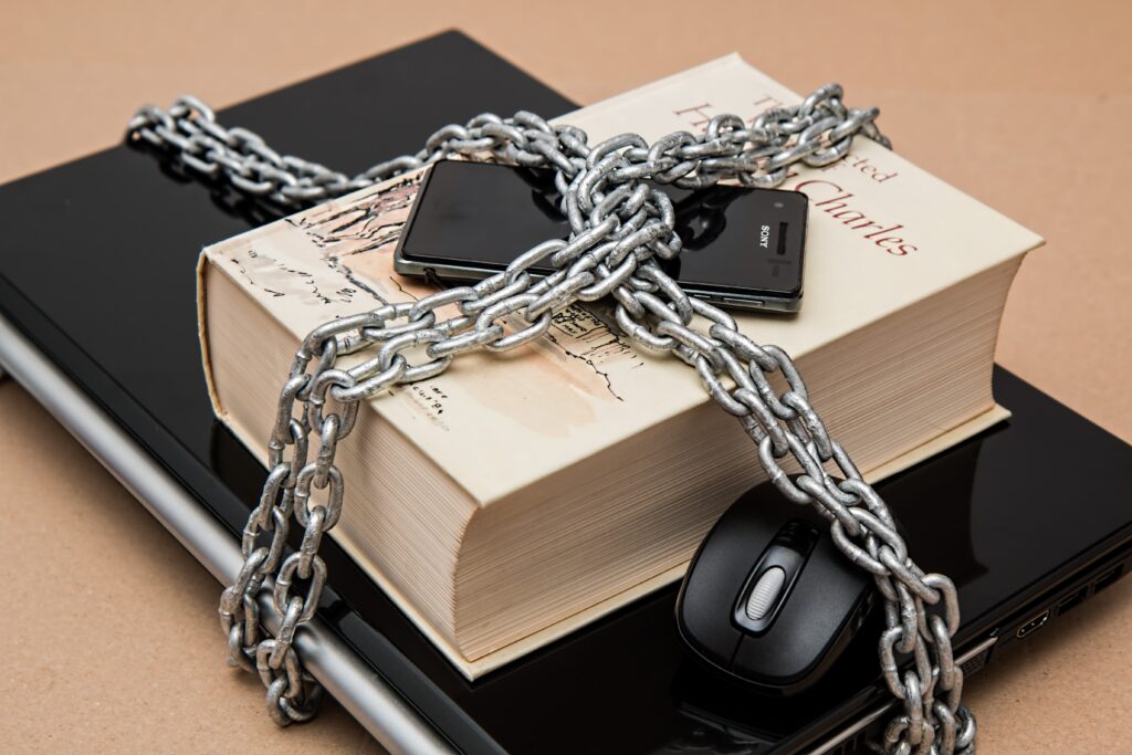 Image shows book and mobile phone locked for privacy